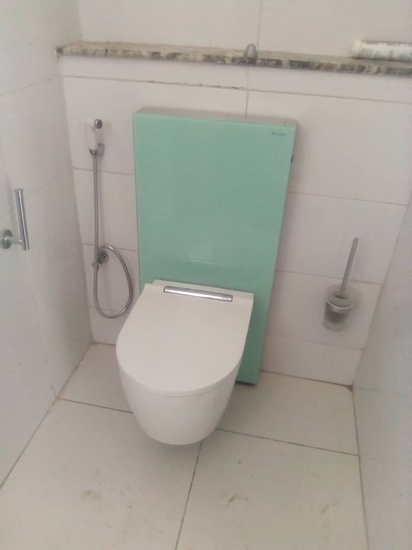 Modern toilet plumbing installation completed by Ozimco